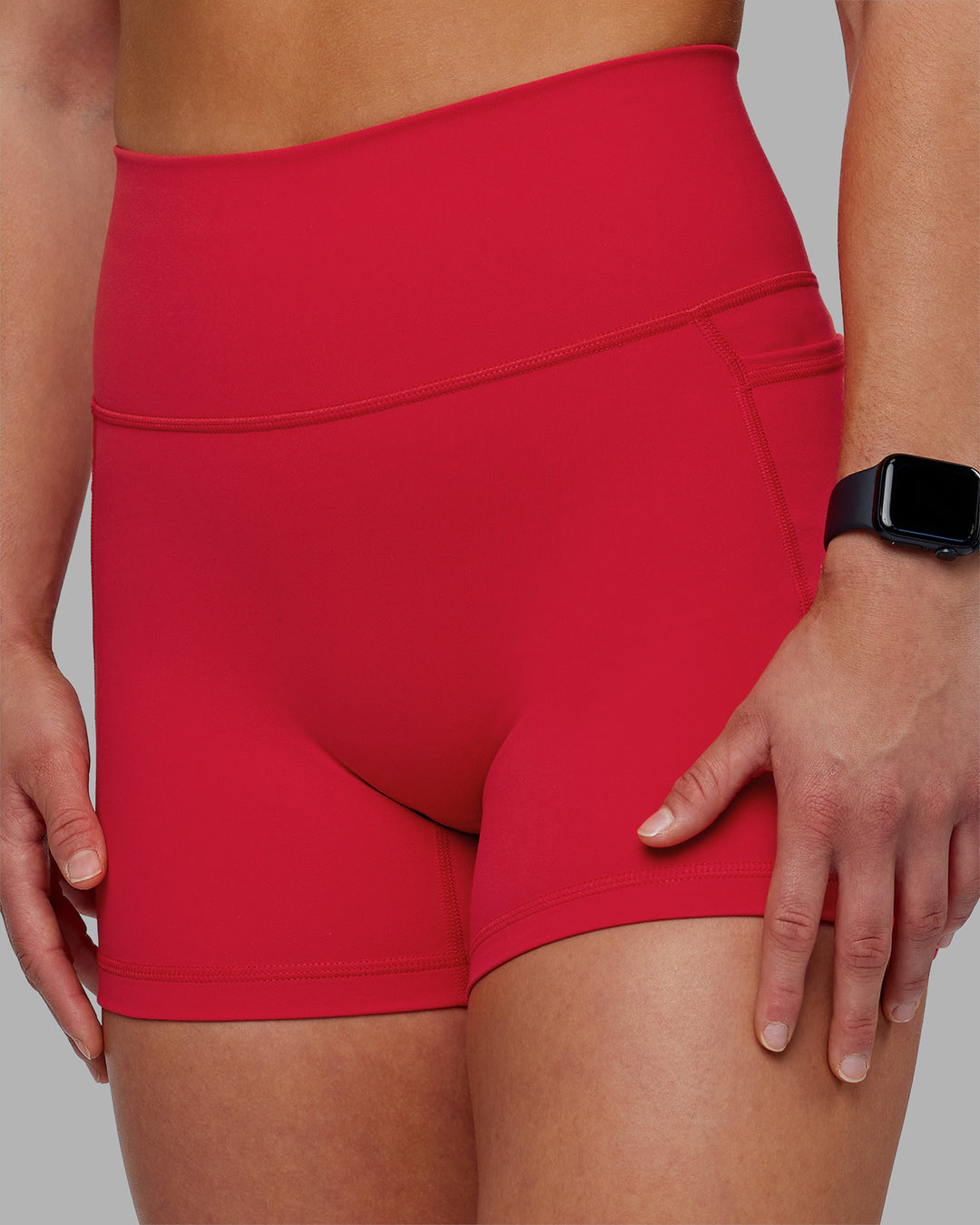 Woman wearing Fusion Ultra High-Rise 4" Short Pockets - Scarlet | Model:Keisha | Size:S