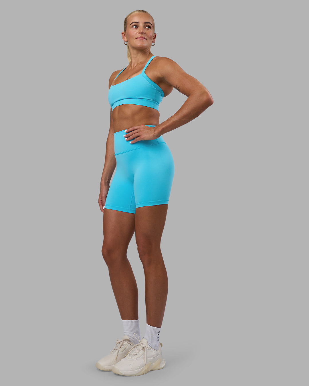 Woman wearing Fusion Ultra High-Rise 6" Short - Blue Atoll | Model:Katie | Size:S