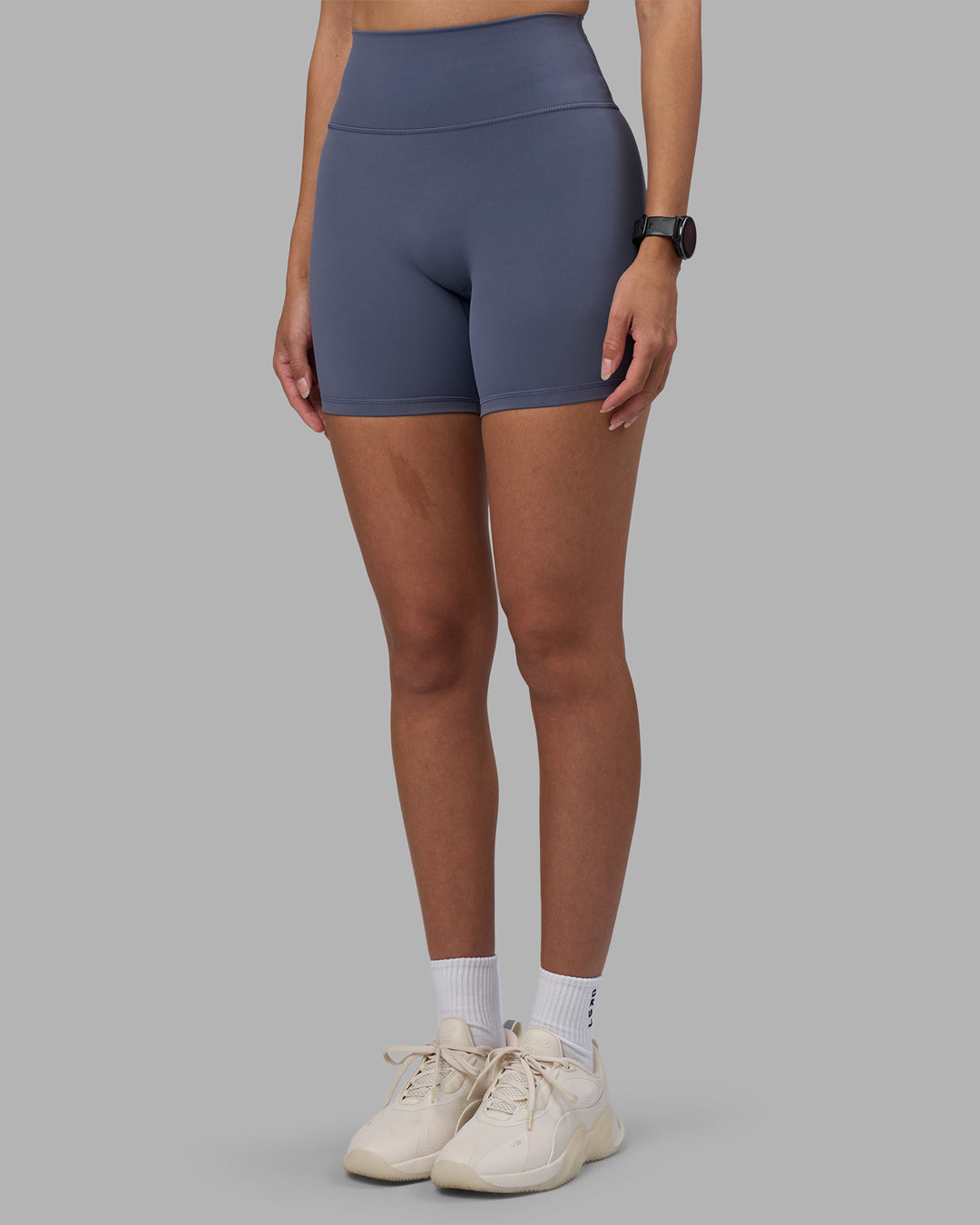 Woman wearing Fusion Ultra High-Rise 6" Short - Night Shadow | Model:Rhiley | Size:S