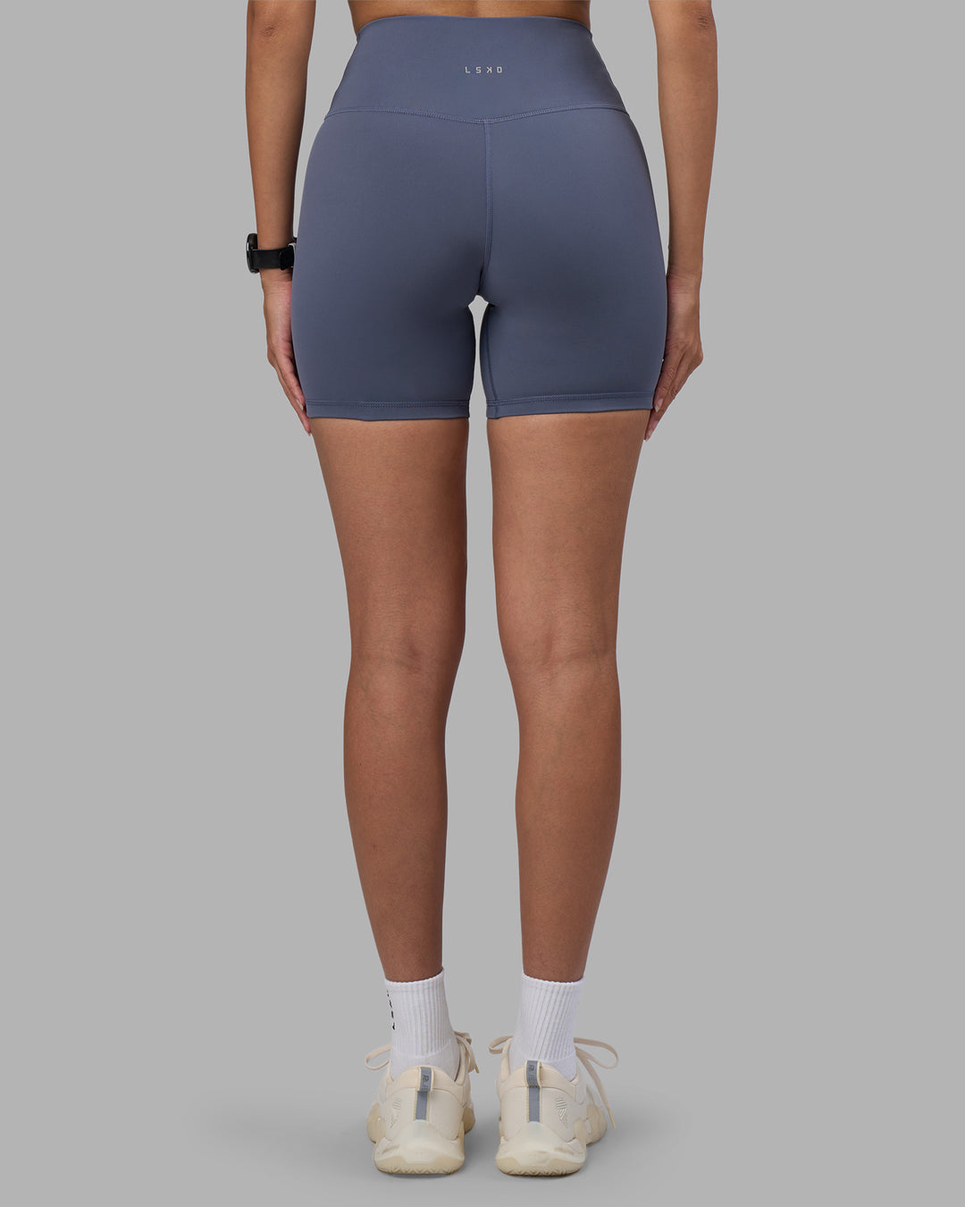 Woman wearing Fusion Ultra High-Rise 6" Short - Night Shadow | Model:Rhiley | Size:S