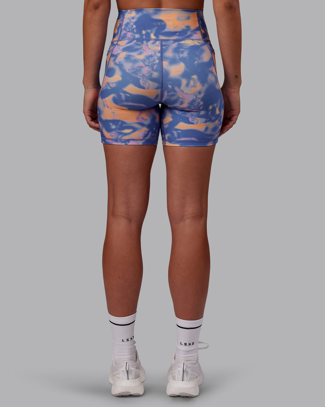 Woman wearing Fusion Ultra High-Rise 6" Short Pockets - Apricot Mist | Model:Charlize | Size:S