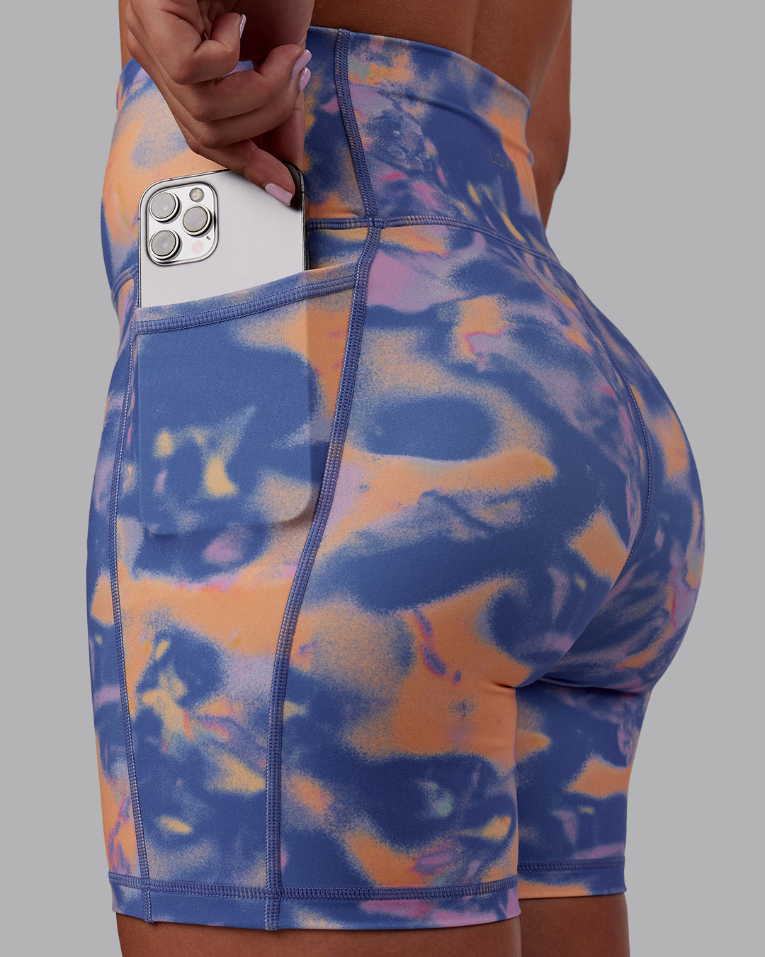 Woman wearing Fusion Ultra High-Rise 6" Short Pockets - Apricot Mist | Model:Charlize | Size:S