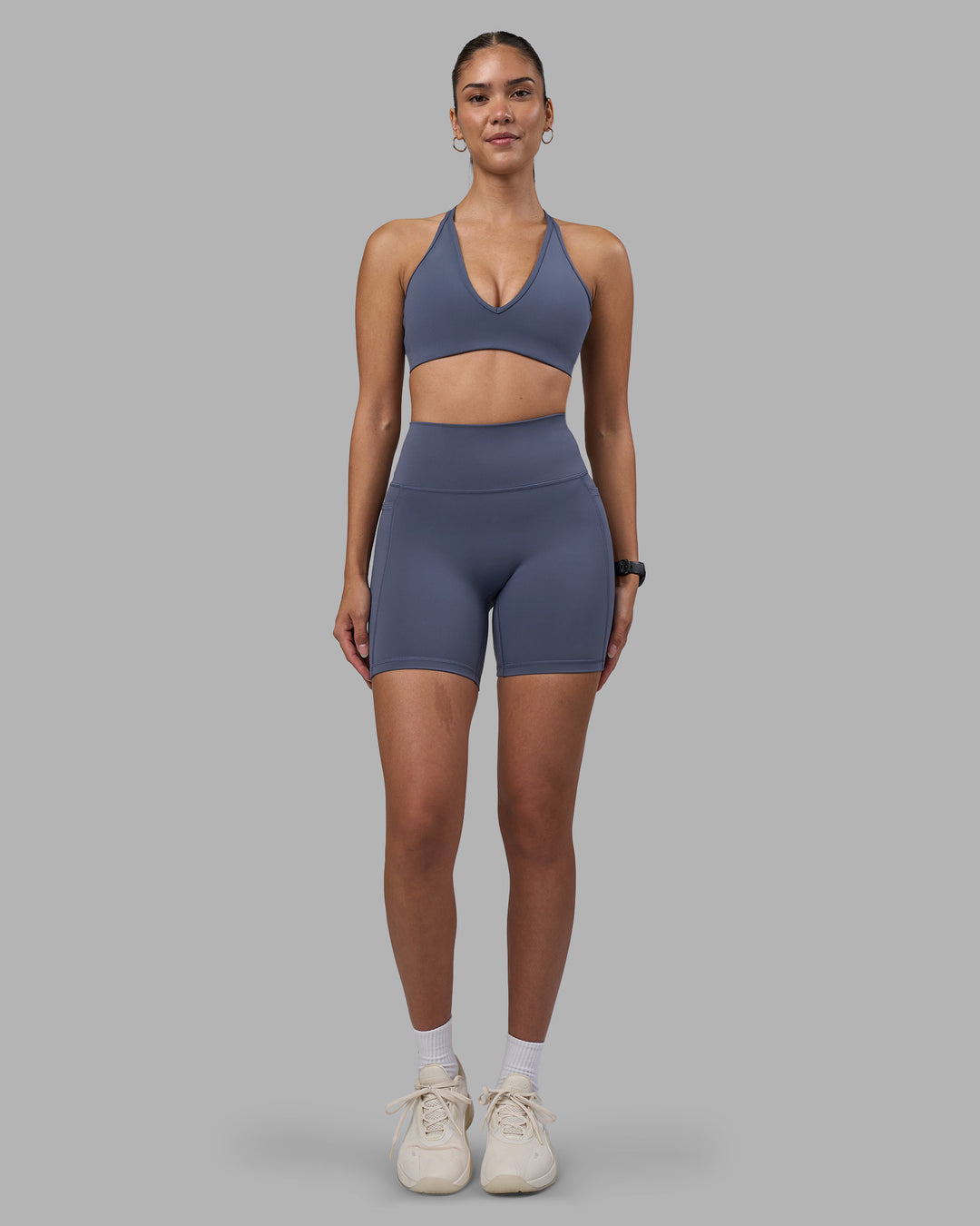 Woman wearing Fusion Ultra High-Rise 6" Short Pockets - Night Shadow | Model:Rhiley | Size:S