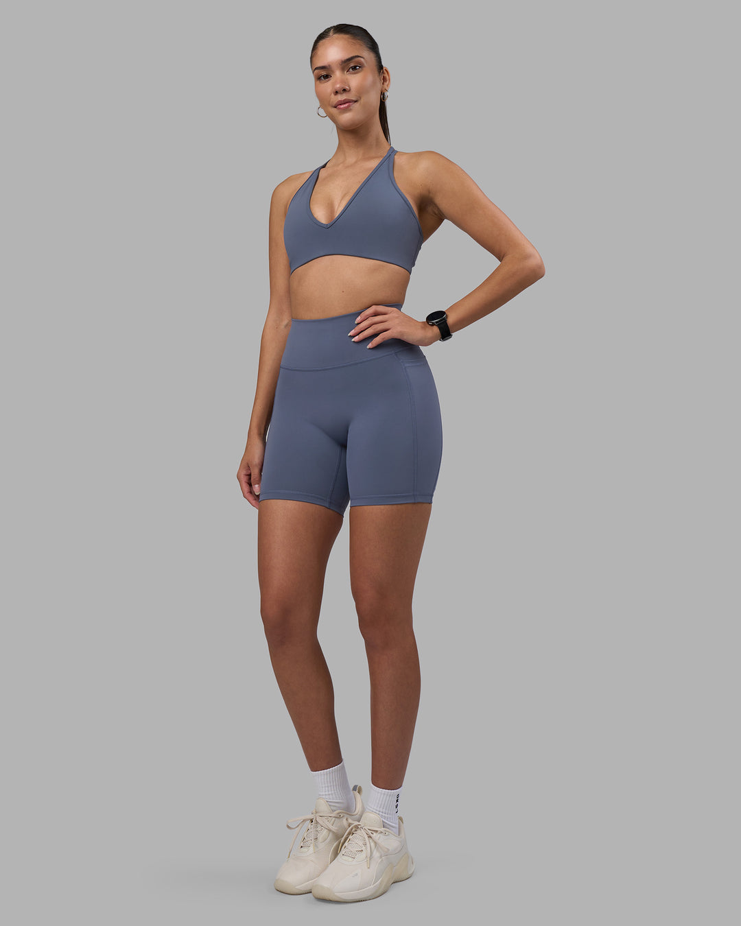 Woman wearing Fusion Ultra High-Rise 6" Short Pockets - Night Shadow | Model:Rhiley | Size:S
