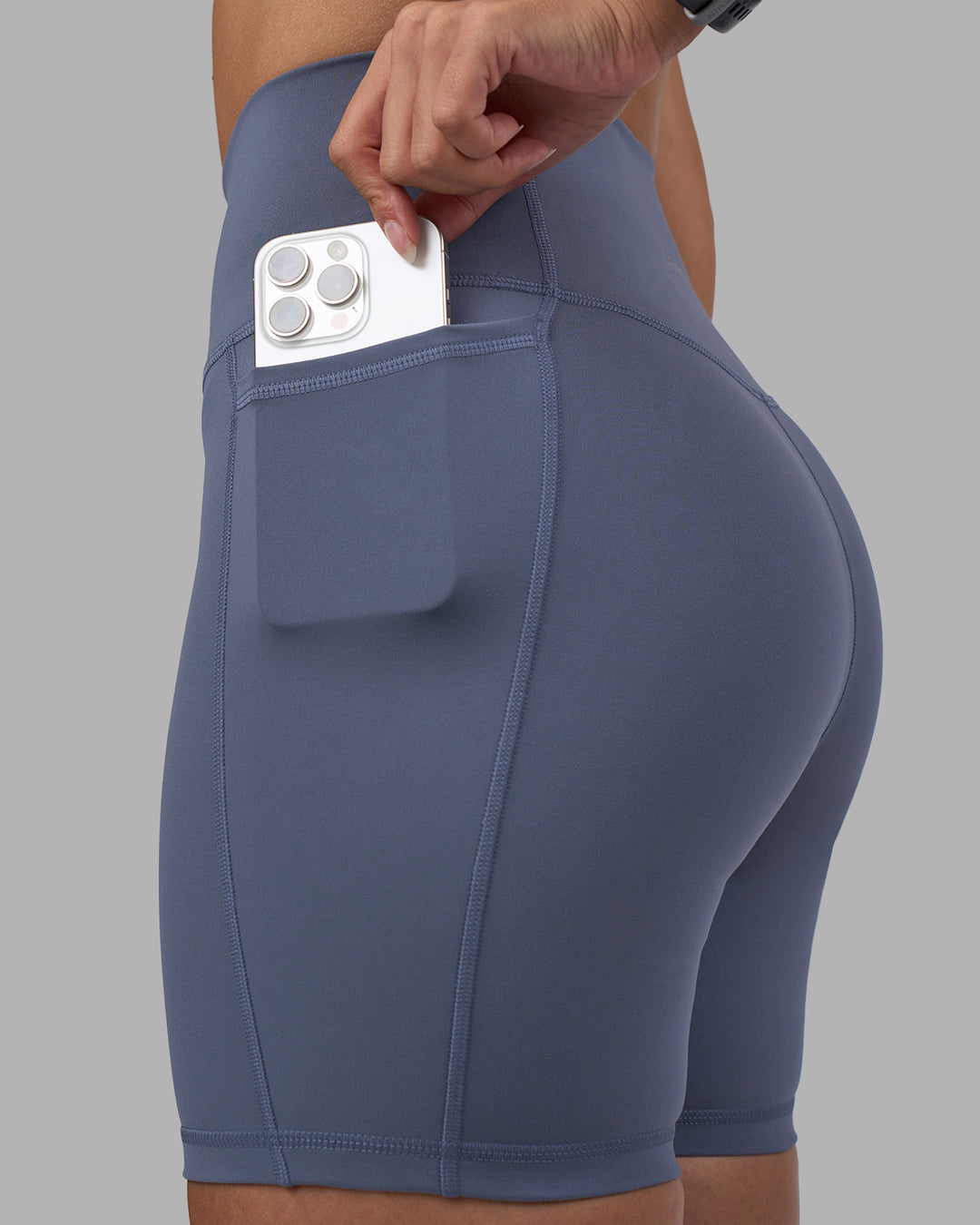 Woman wearing Fusion Ultra High-Rise 6" Short Pockets - Night Shadow | Model:Rhiley | Size:S
