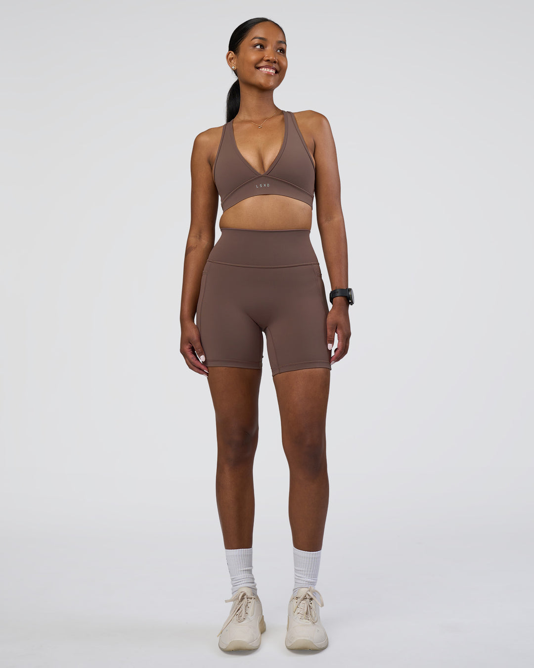 Woman wearing Fusion Ultra High-Rise 6" Short Pockets - Peppercorn | Model:Rica | Size:S