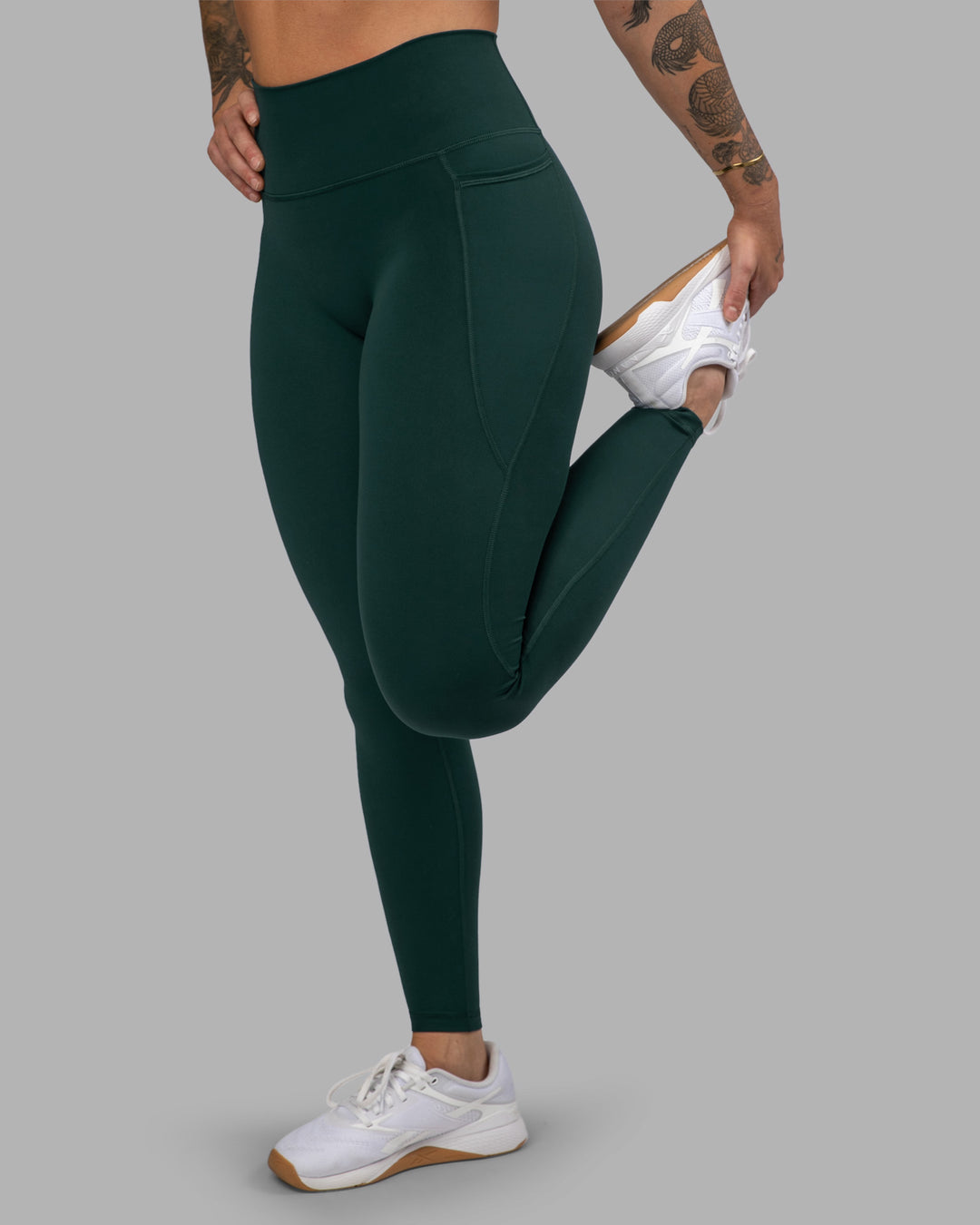 Woman wearing Fusion Ultra High-Rise Full Length Legging Pockets - Dark Moss | Model:Robyn | Size:S