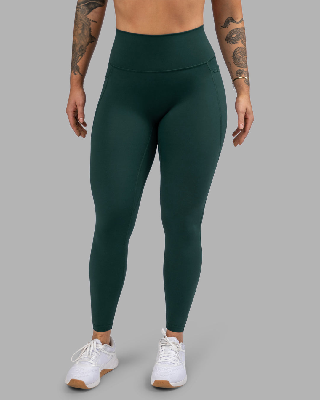 Woman wearing Fusion Ultra High-Rise Full Length Legging Pockets - Dark Moss | Model:Robyn | Size:S