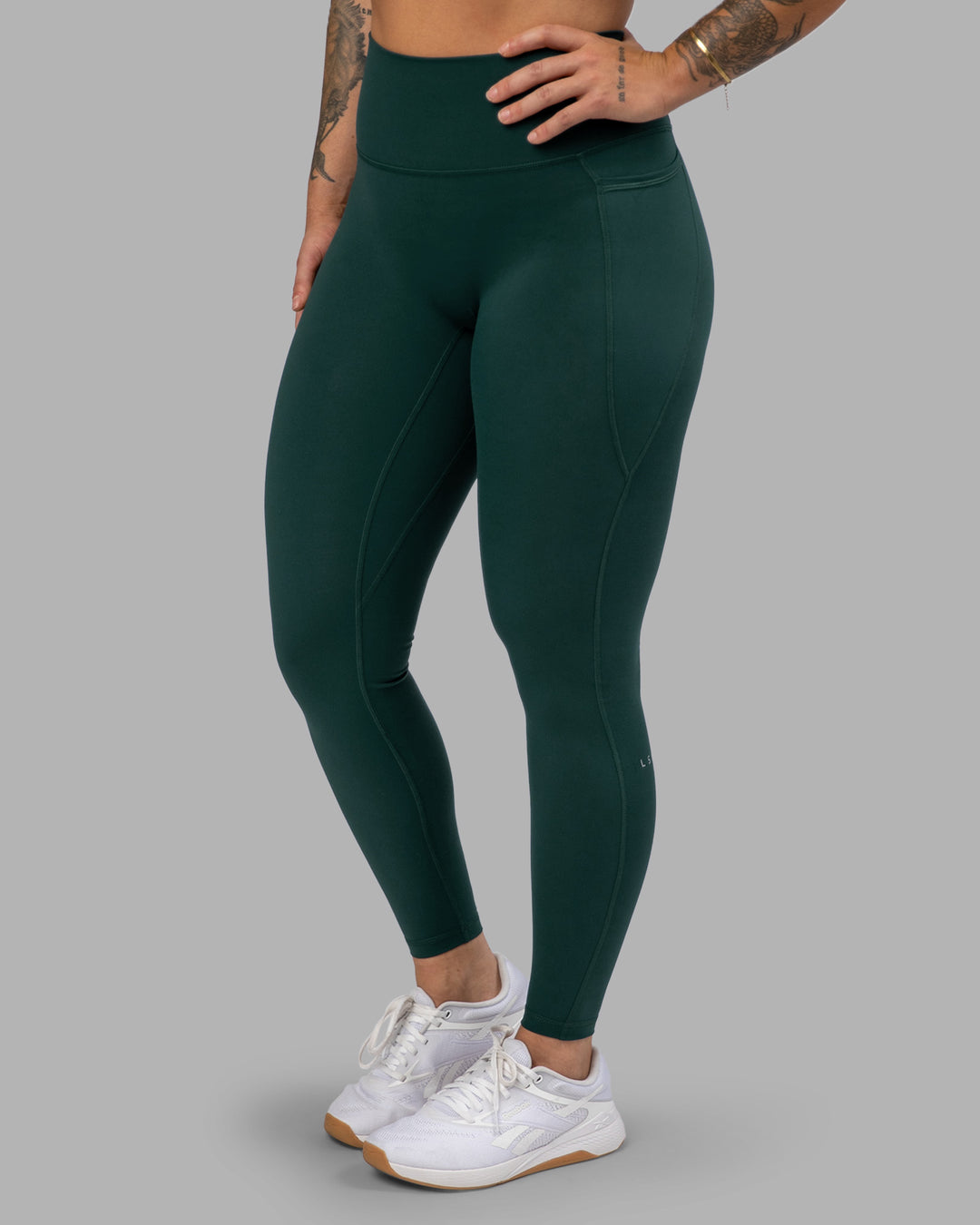 Woman wearing Fusion Ultra High-Rise Full Length Legging Pockets - Dark Moss | Model:Robyn | Size:S