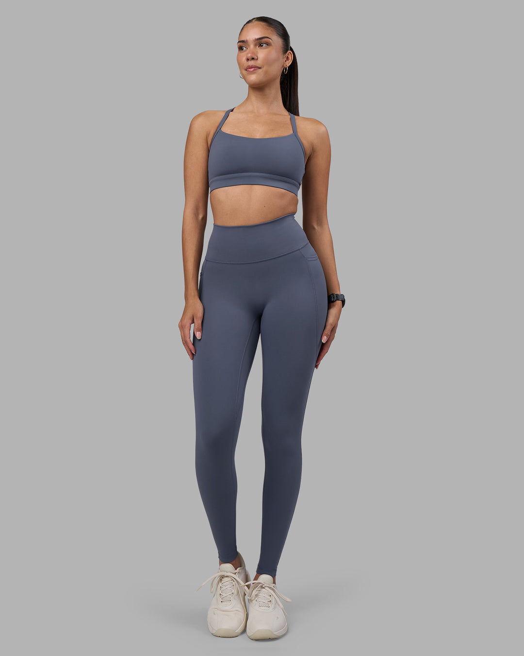 Woman wearing Fusion Ultra High-Rise Full Length Legging Pockets - Night Shadow | Model:Rhiley | Size:S