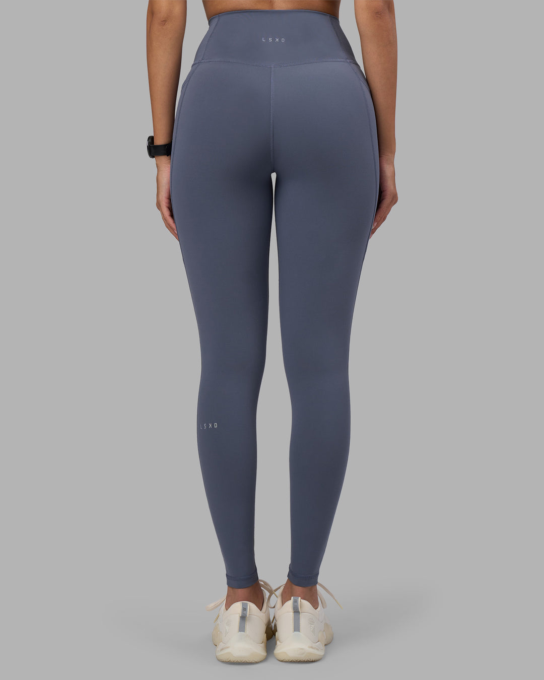 Woman wearing Fusion Ultra High-Rise Full Length Legging Pockets - Night Shadow | Model:Rhiley | Size:S