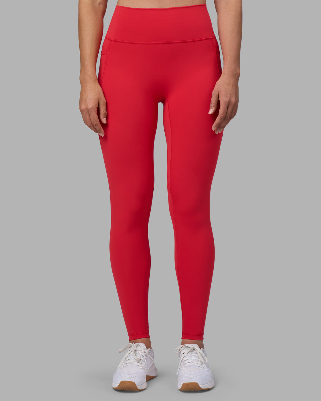 Woman wearing Fusion Ultra High-Rise Full Length Legging Pockets - Scarlet | Model:Sophie | Size:S