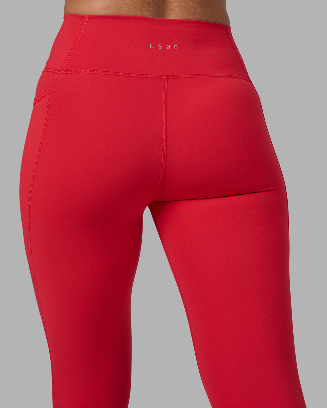 Woman wearing Fusion Ultra High-Rise Full Length Legging Pockets - Scarlet | Model:Sophie | Size:S