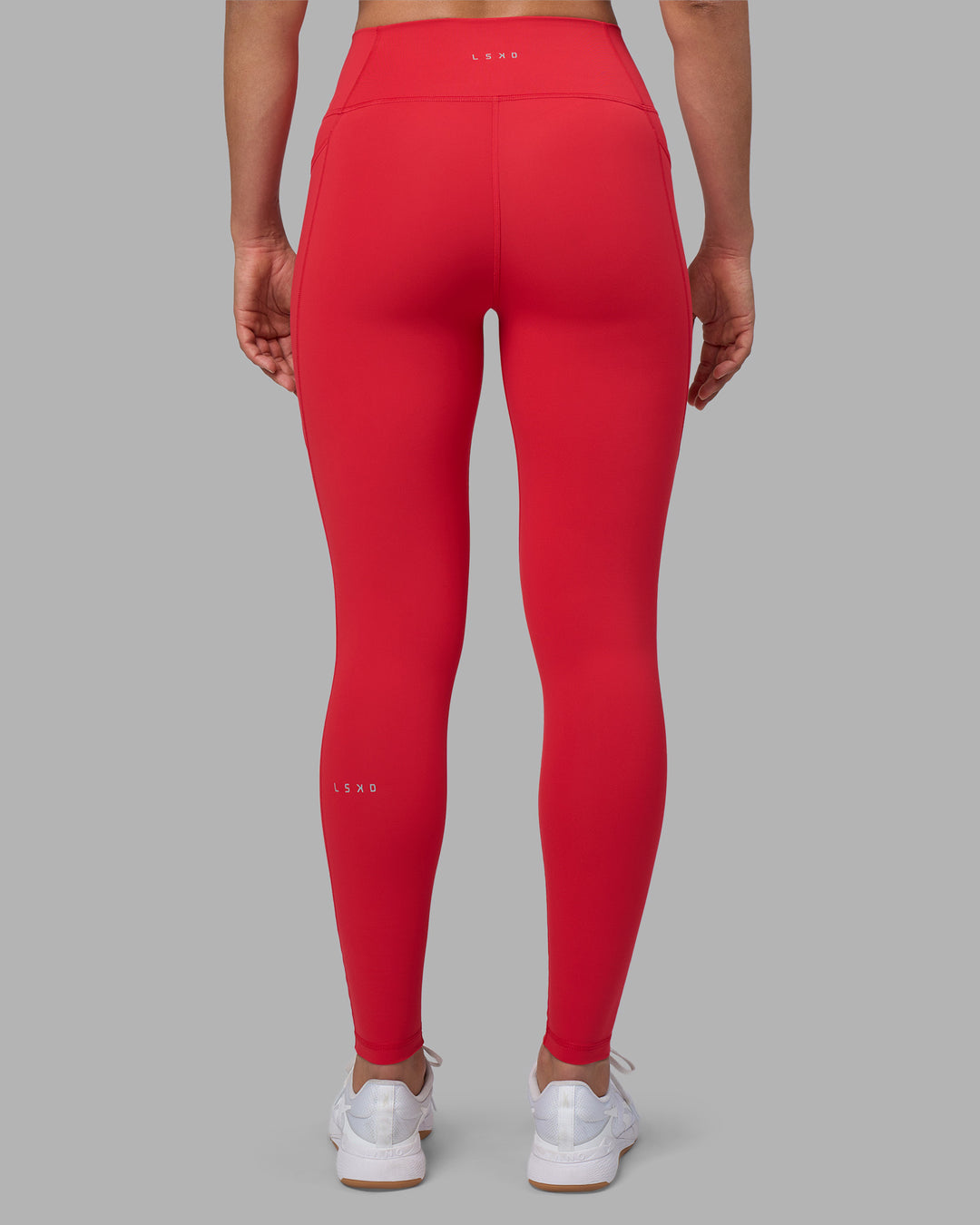 Woman wearing Fusion Ultra High-Rise Full Length Legging Pockets - Scarlet | Model:Sophie | Size:S