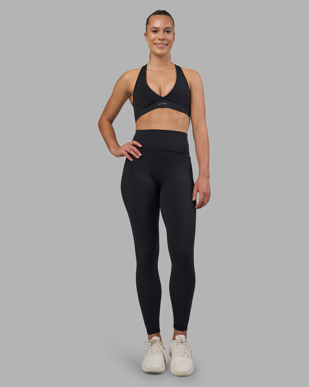 Woman wearing Fusion V-Contour Ultra High-Rise Full Length Legging Pockets - Black | Model:Charlize | Size:S