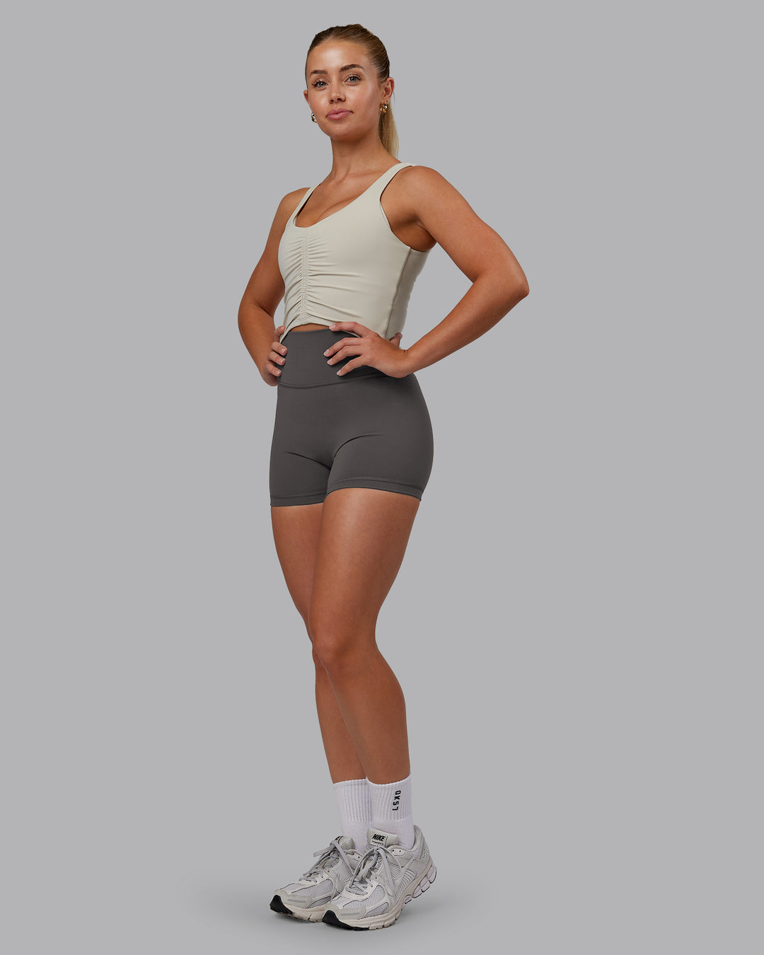 Woman wearing Fusion Ultra High-Rise 4" Short - Dark Storm | Model:Hannah | Size:S