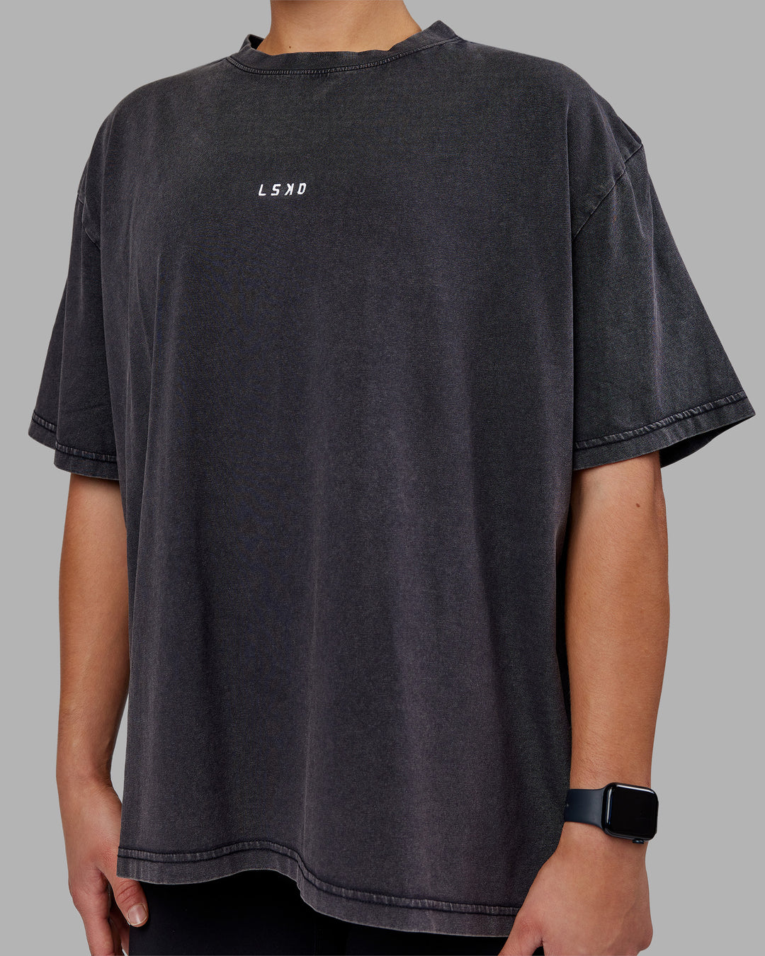 Woman wearing Go-To FLXCotton Oversized Tee - Black Washed-White | Model:Keisha | Size:S