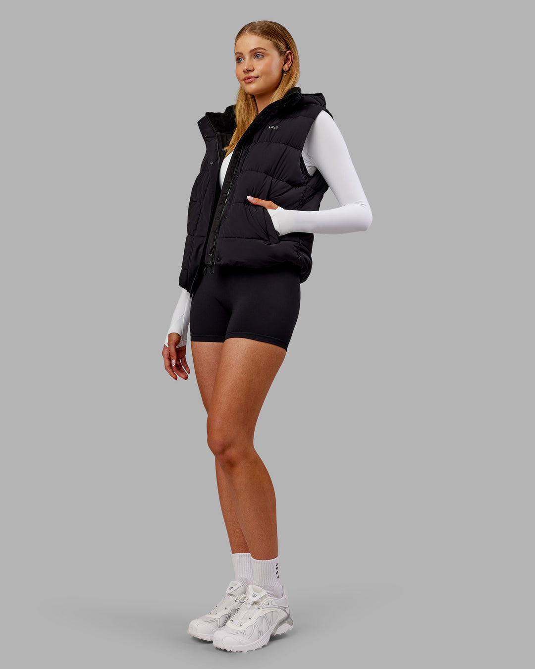 Woman wearing Go-To Puffer Vest - Black | Model:Ella | Size:S