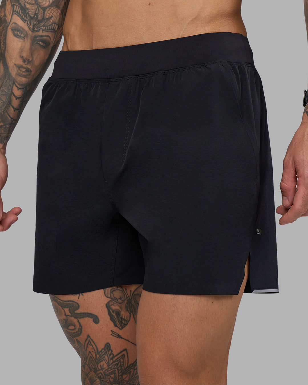 Man wearing Hybrid 5" Short - Black-Reflective | Model:Tommy | Size:S