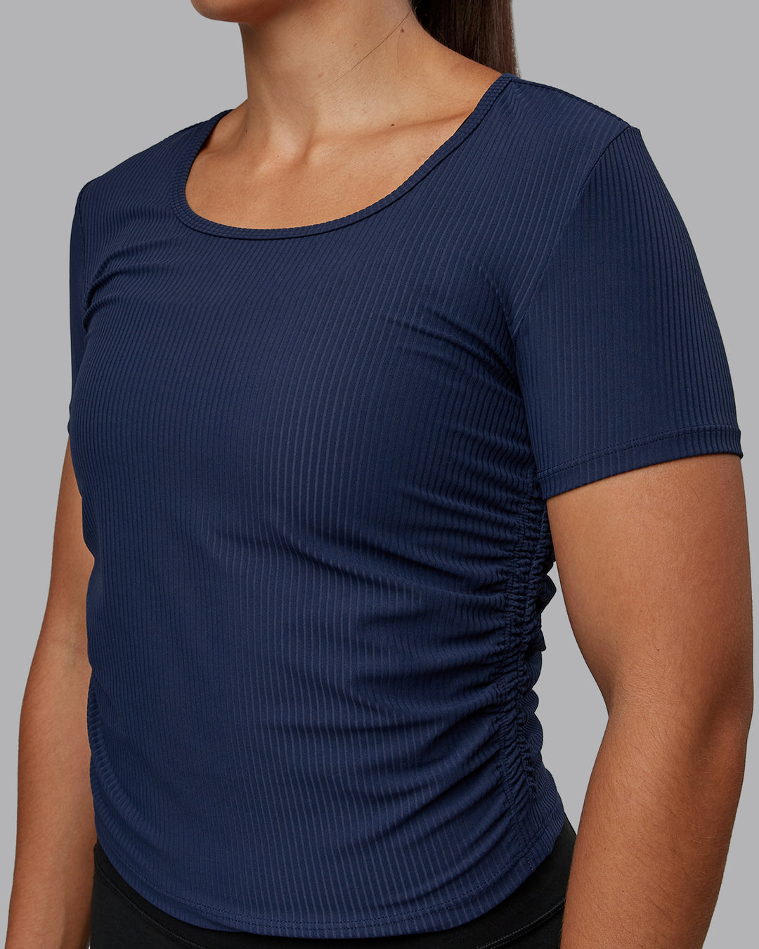 Woman wearing Ignite Ribbed Scrunch Side Cropped Tee - Future Navy | Size:S | Model:Tylah