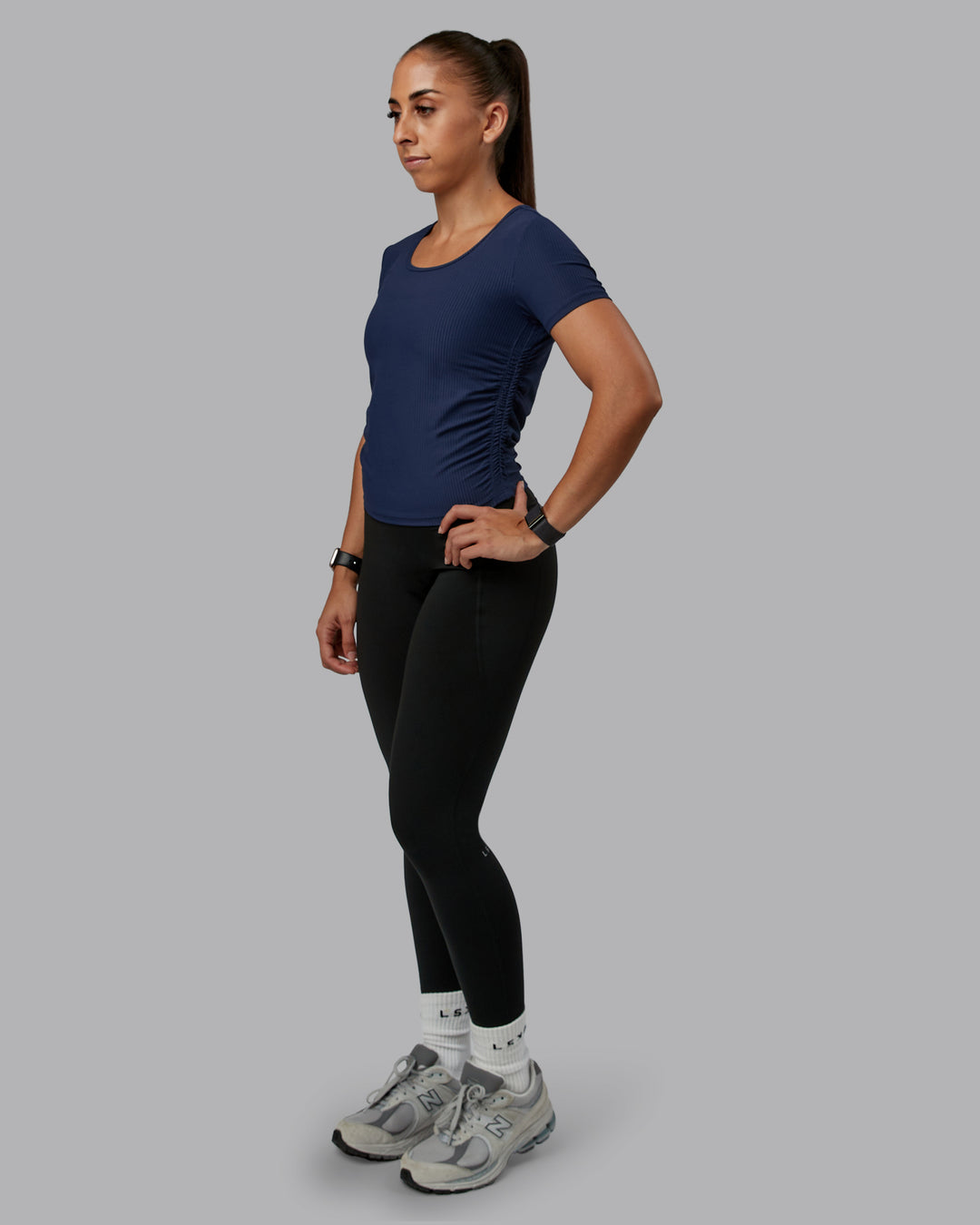 Woman wearing Ignite Ribbed Scrunch Side Cropped Tee - Future Navy | Size:S | Model:Tylah