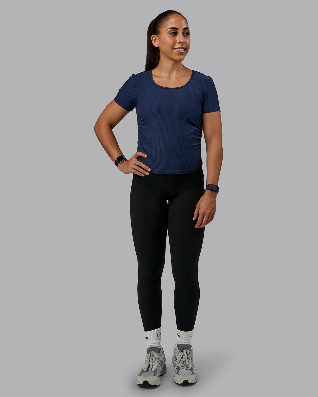 Woman wearing Ignite Ribbed Scrunch Side Cropped Tee - Future Navy | Size:S | Model:Tylah
