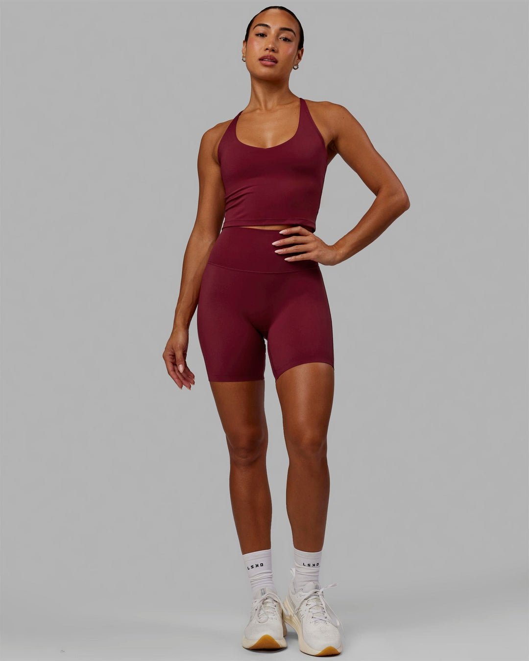Woman wearing Movement Active Tank - Cranberry