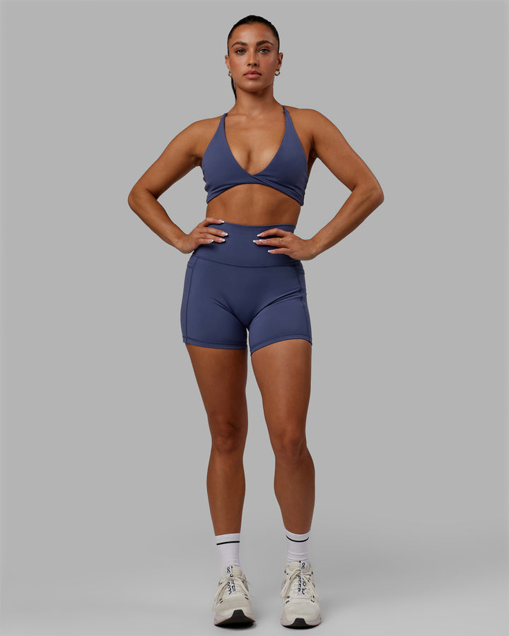 Woman wearing Progression Sports Bra - Future Dusk