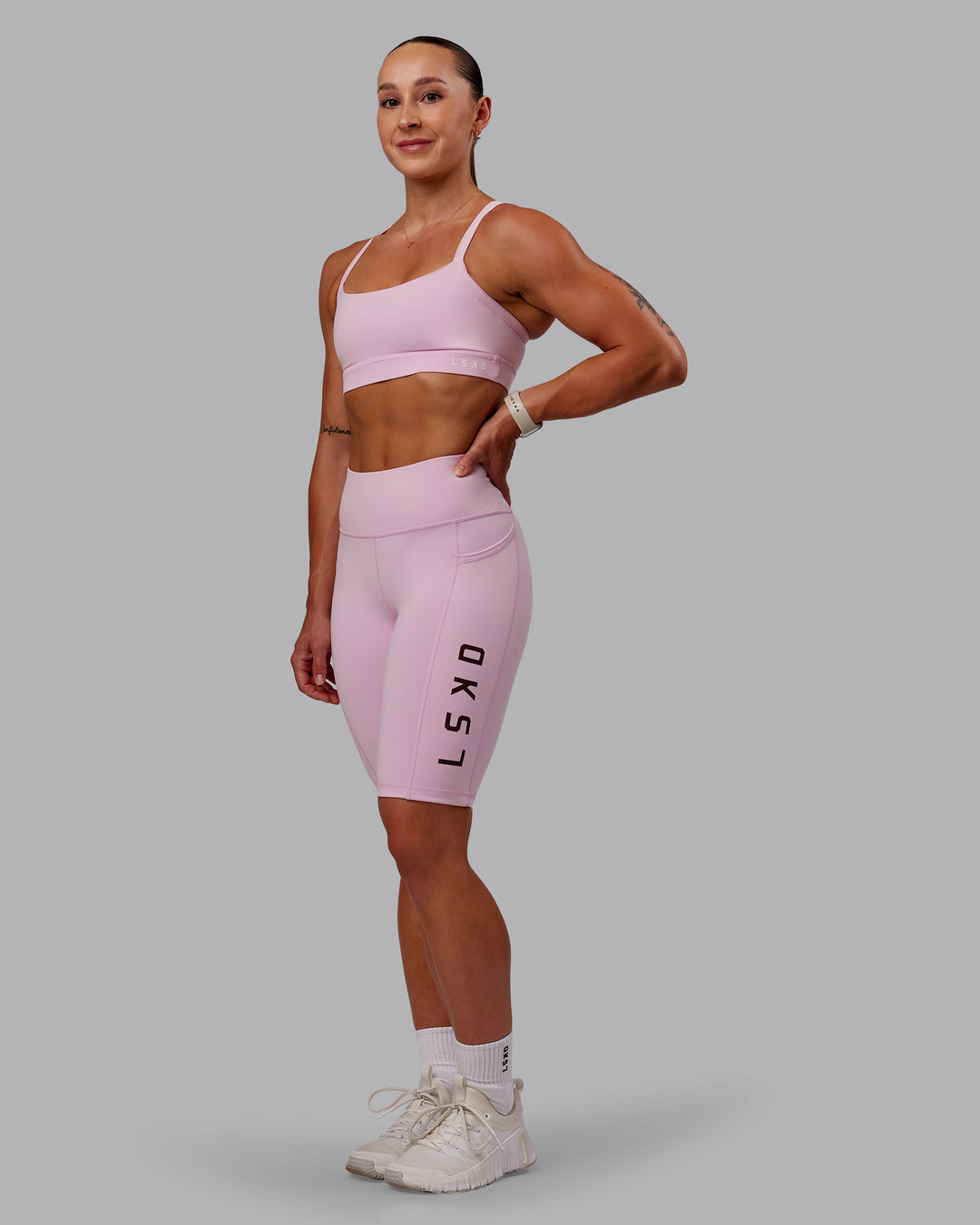 Woman wearing Rep Ultra High-Rise 9" Short Pockets - Marshmallow-Cherry Lacquer | Model:Amber | Size:S