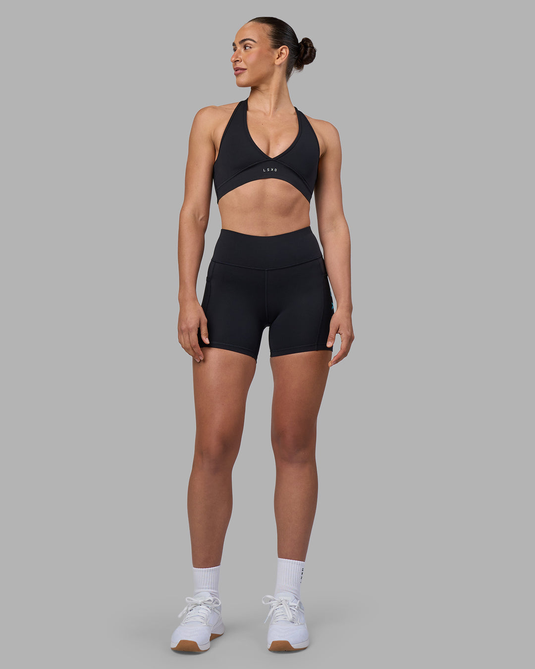 Woman wearing Rep Ultra High-Rise 4" Short Pockets - Black-Blue Atoll | Model:Sophie | Size:S