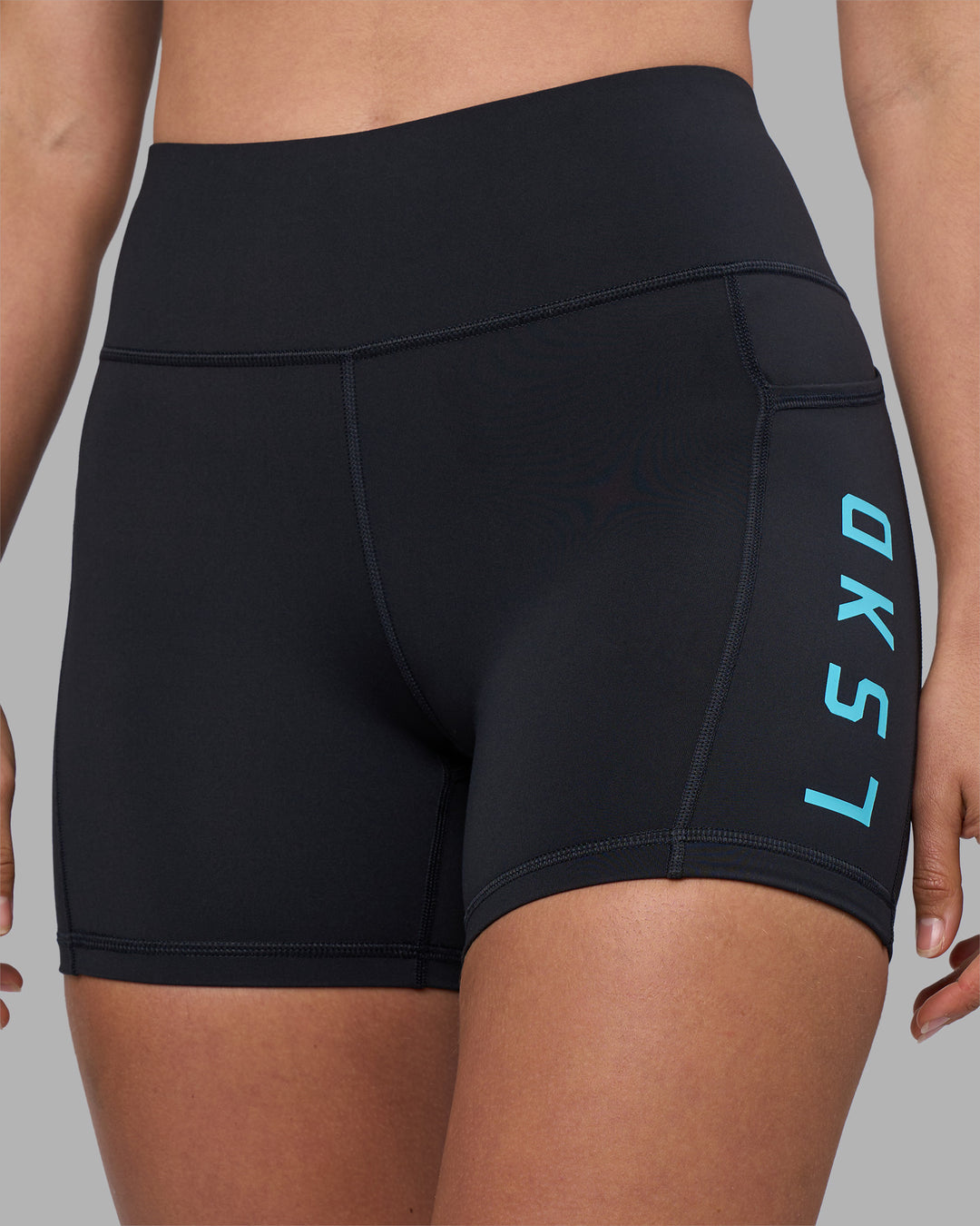 Woman wearing Rep Ultra High-Rise 4" Short Pockets - Black-Blue Atoll | Model:Sophie | Size:S