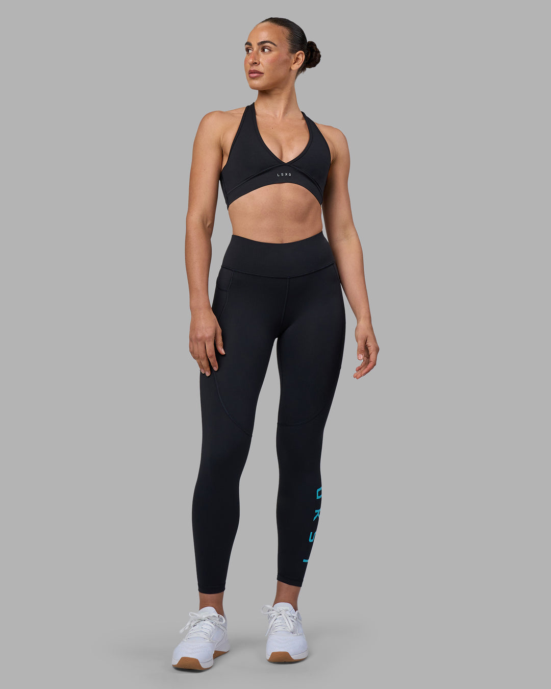 Woman wearing Rep Ultra High-Rise 7/8 Legging Pockets - Black-Blue Atoll | Model:Sophie | Size:S