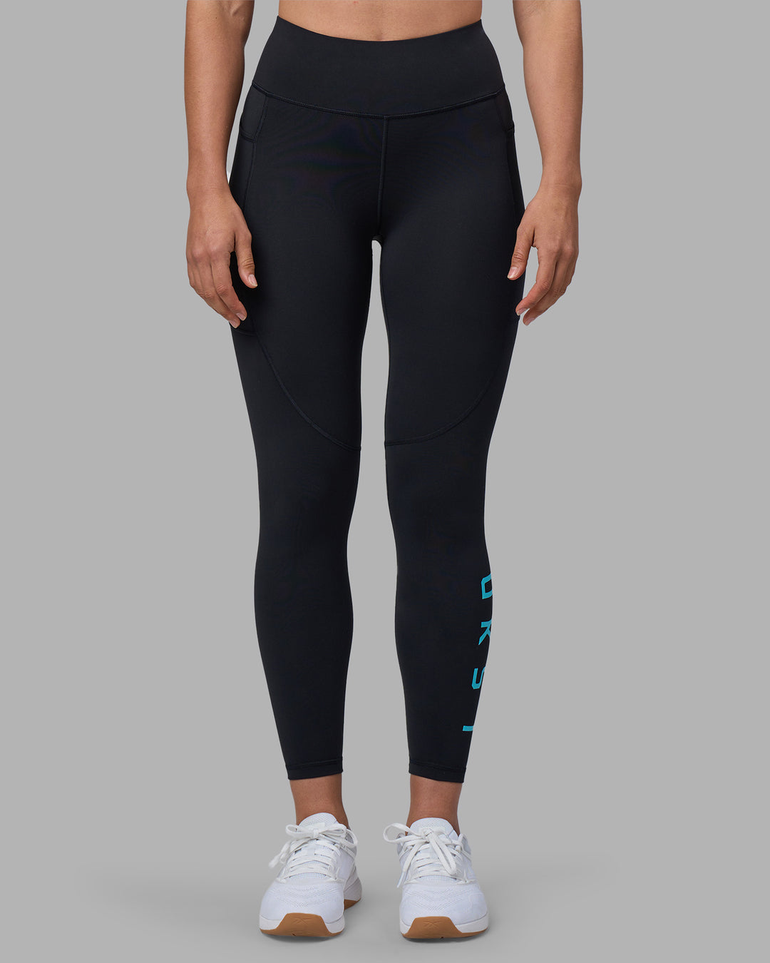 Woman wearing Rep Ultra High-Rise 7/8 Legging Pockets - Black-Blue Atoll | Model:Sophie | Size:S
