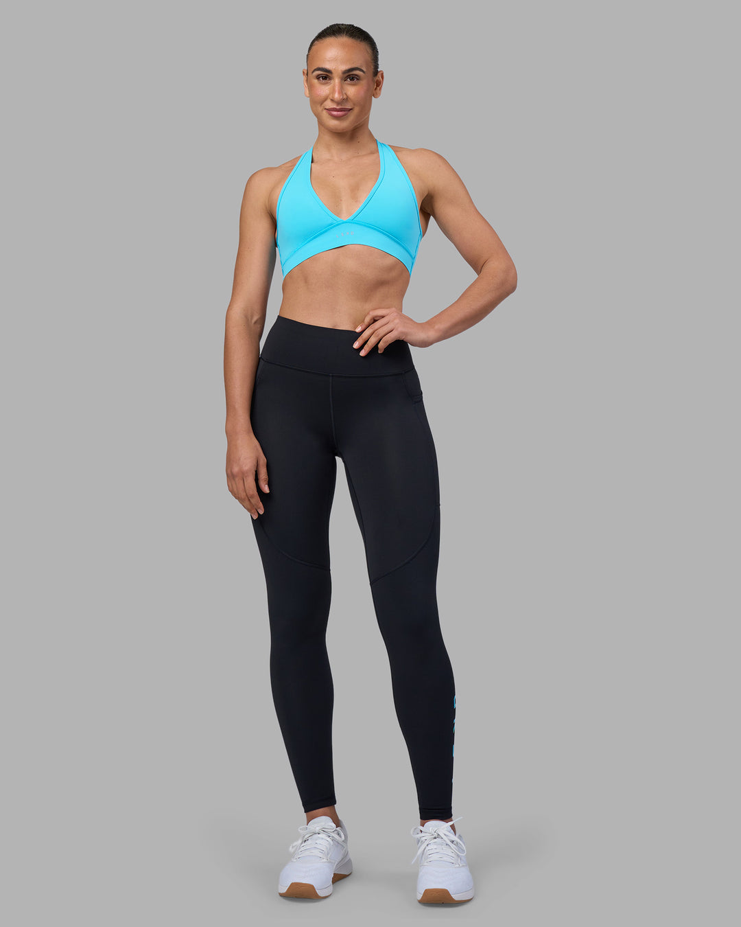 Woman wearing Rep Ultra High-Rise Full Length Legging Pockets - Black-Blue Atoll | Model:Sophie | Size:S