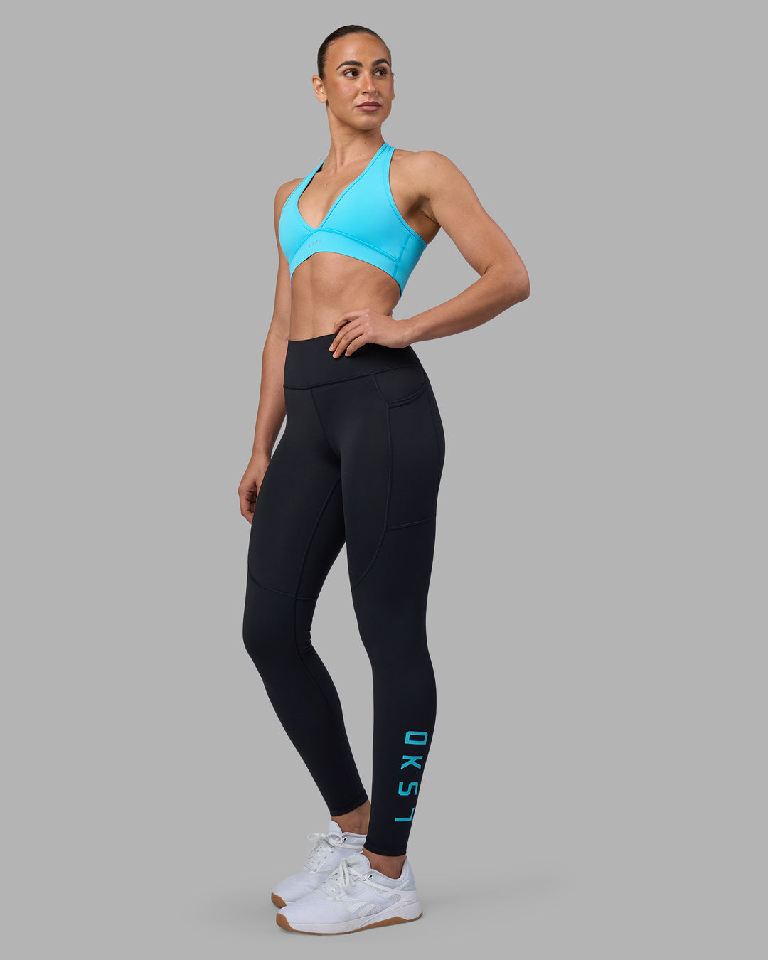 Woman wearing Rep Ultra High-Rise Full Length Legging Pockets - Black-Blue Atoll | Model:Sophie | Size:S