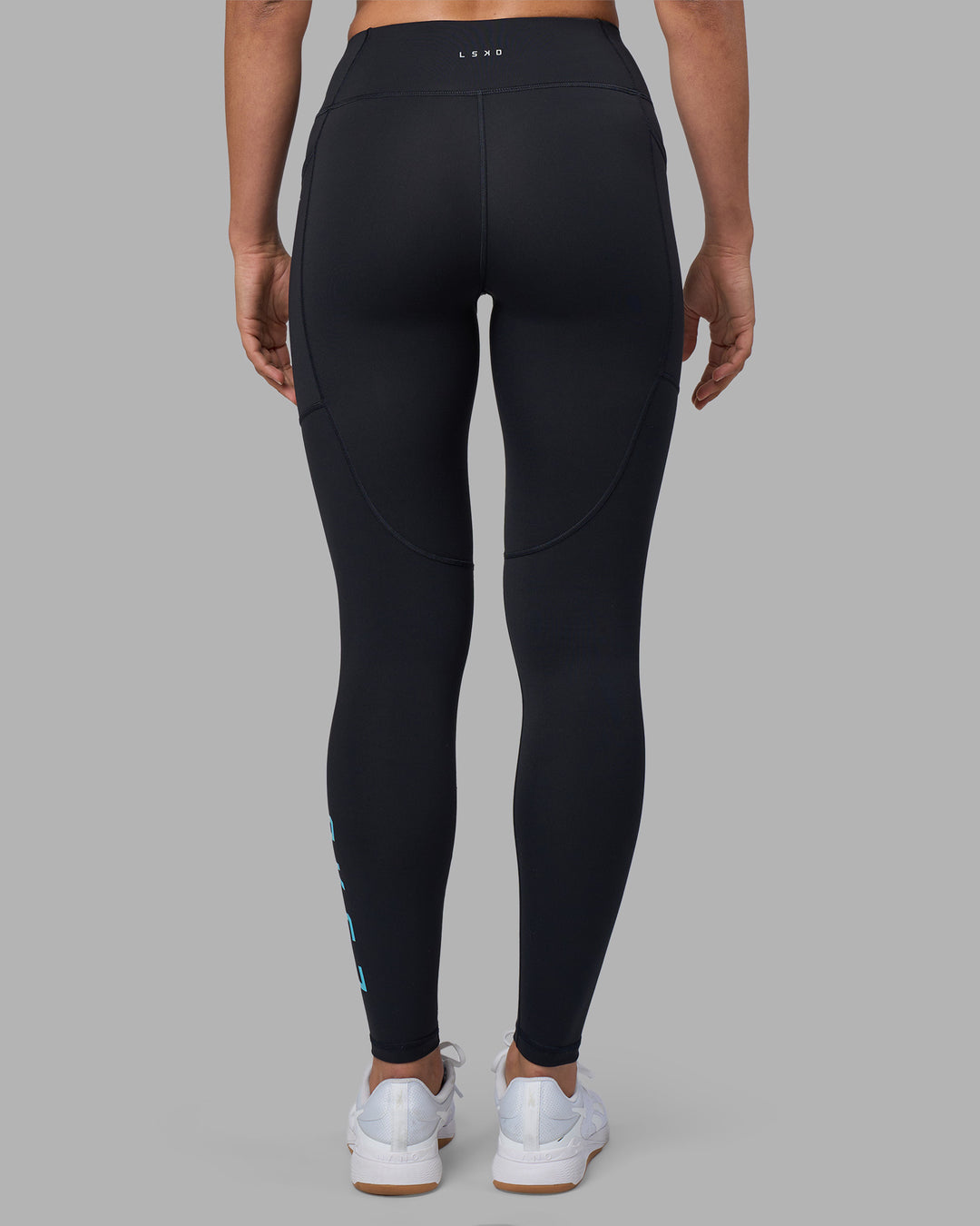 Woman wearing Rep Ultra High-Rise Full Length Legging Pockets - Black-Blue Atoll | Model:Sophie | Size:S