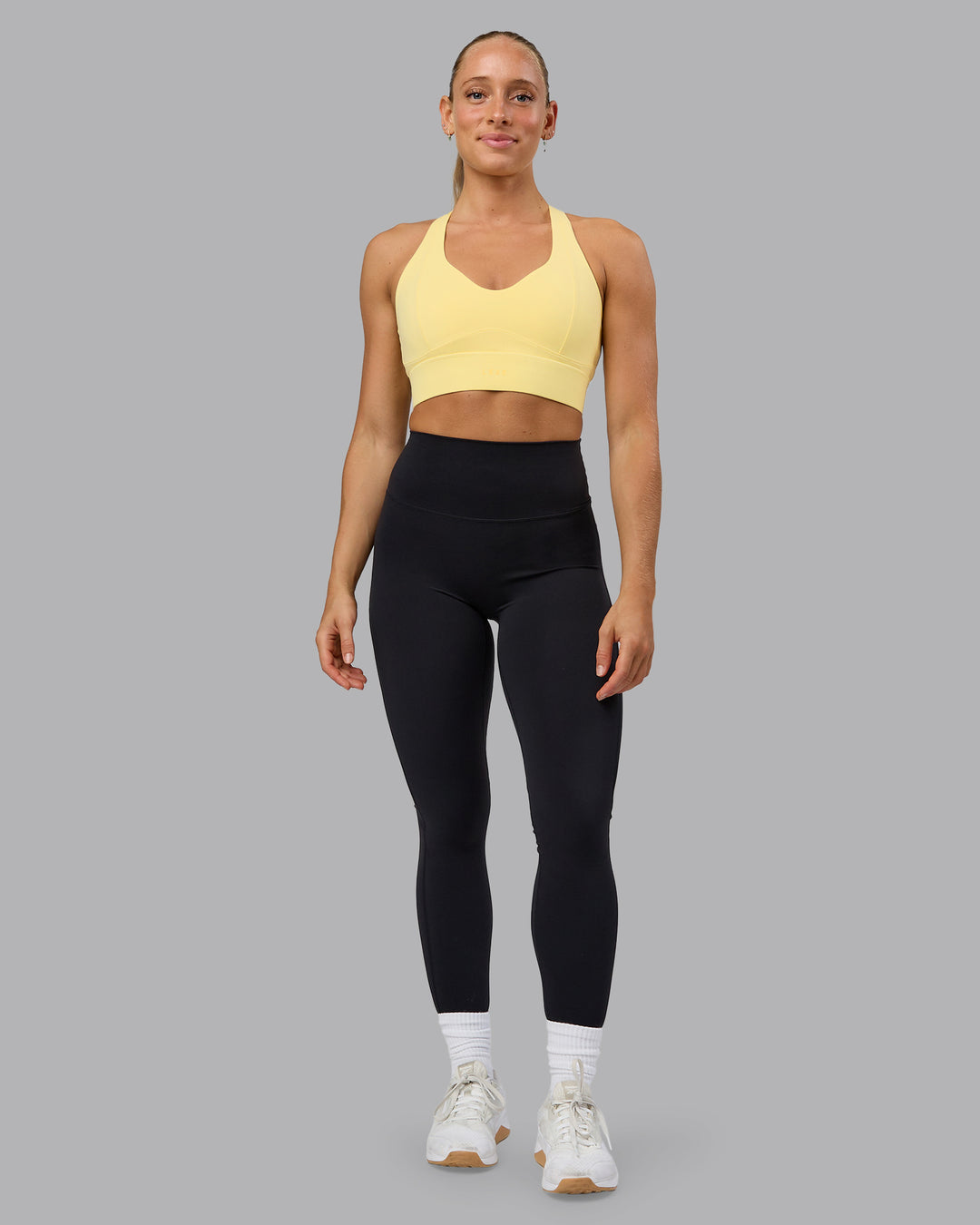 Woman wearing Sculpt Sports Bra - Lemon