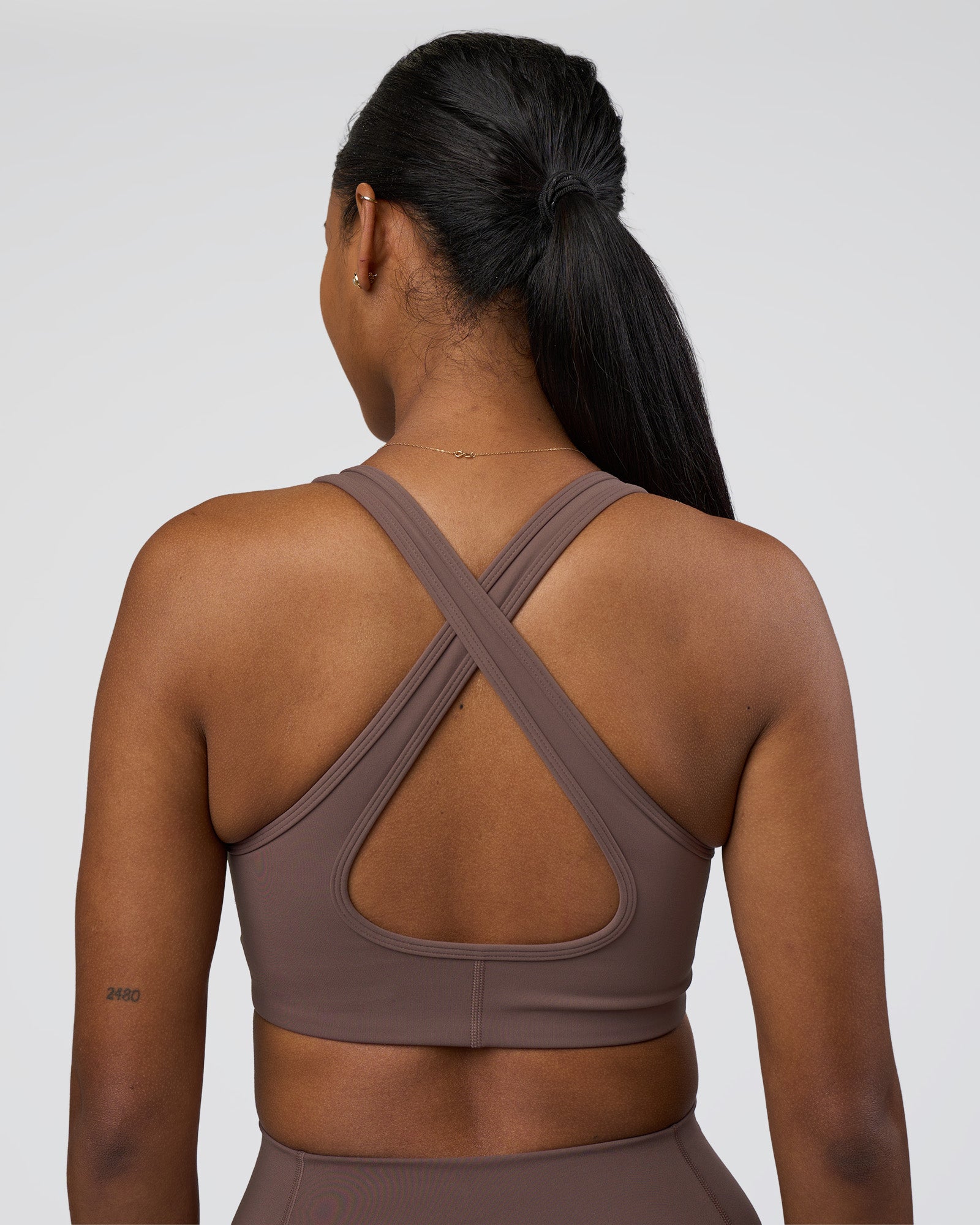 Woman wearing Stamina Sports Bra - Peppercorn | Model:Rica | Size:S