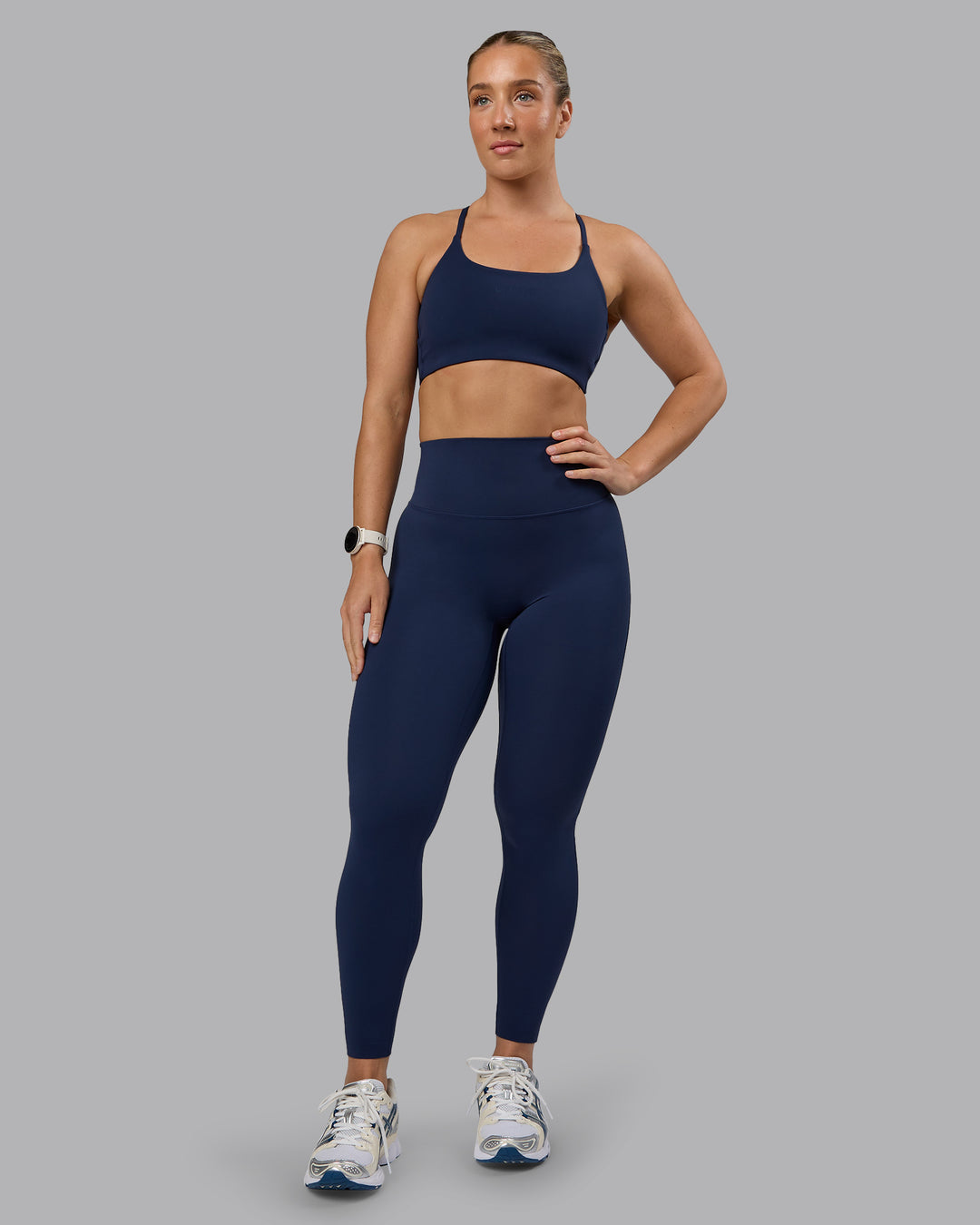 Woman wearing Twist Sports Bra - Future Navy | Model:Lyss | Size:S