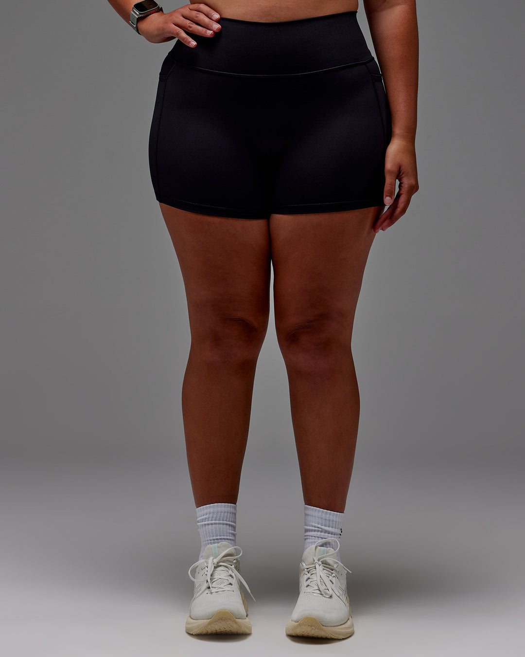 Woman wearing Fusion Ultra High-Rise 4" Short Pockets - Black | Model:Aimee | Size:XL