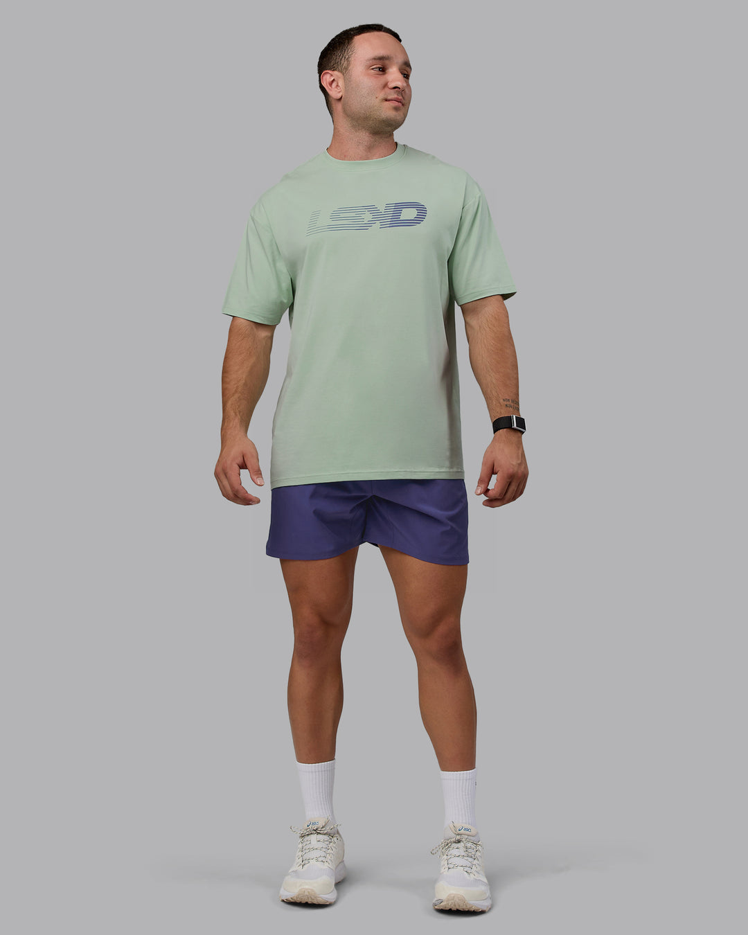 Man wearing Unisex Motion FLXCotton Tee Oversize - Surf Spray-Royal Purple