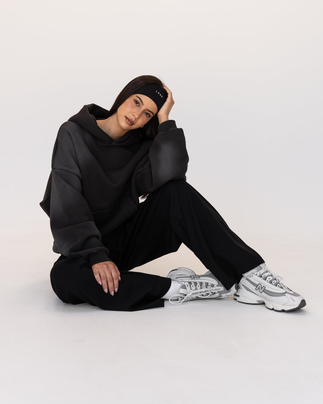 Woman wearing Memory In Motion 500gsm Ultra Heavyweight Washed Hoodie - Charcoal Washed | Model:Eliza | Size:XS
