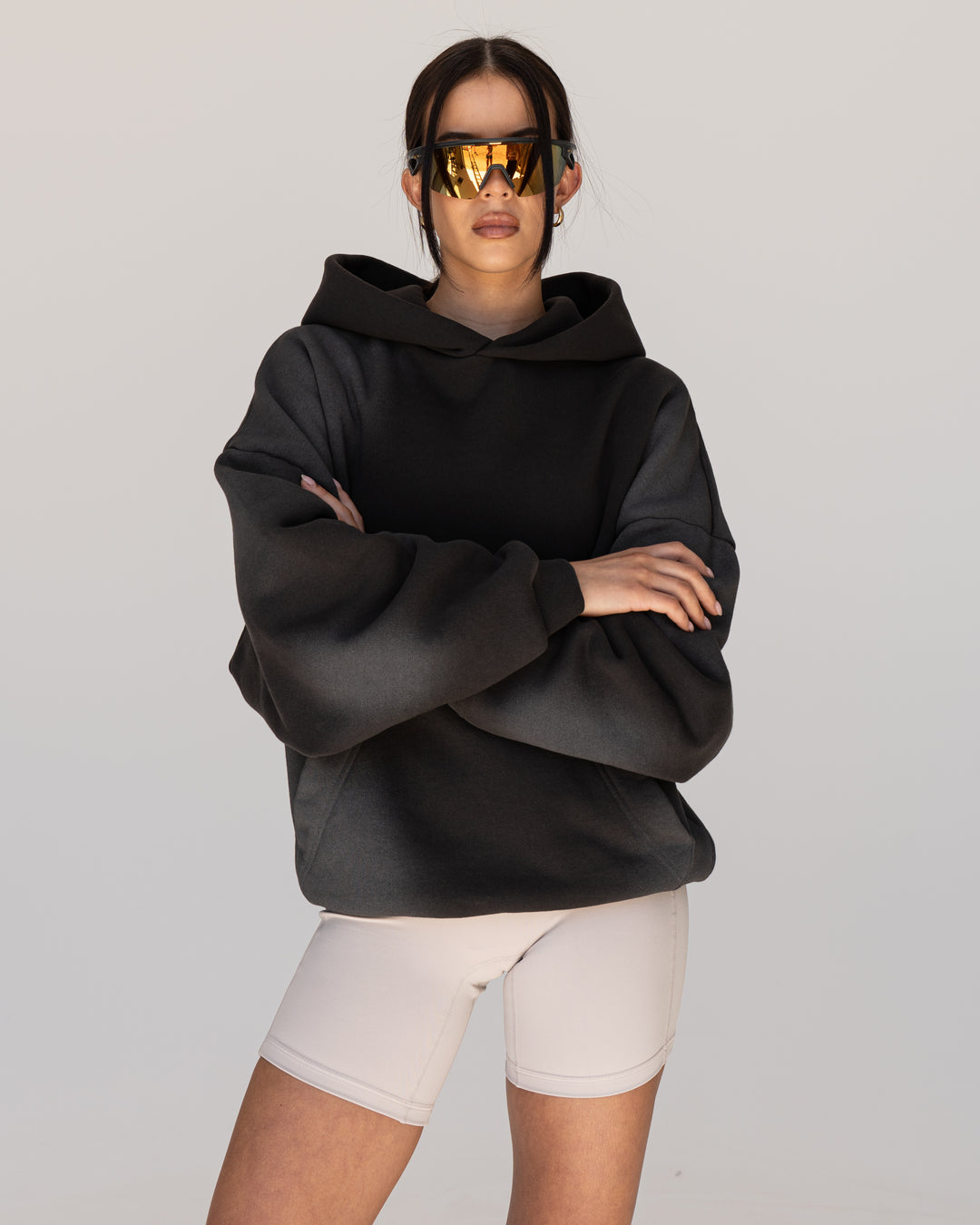 Woman wearing Memory In Motion 500gsm Ultra Heavyweight Washed Hoodie - Charcoal Washed | Model:Eliza | Size:XS