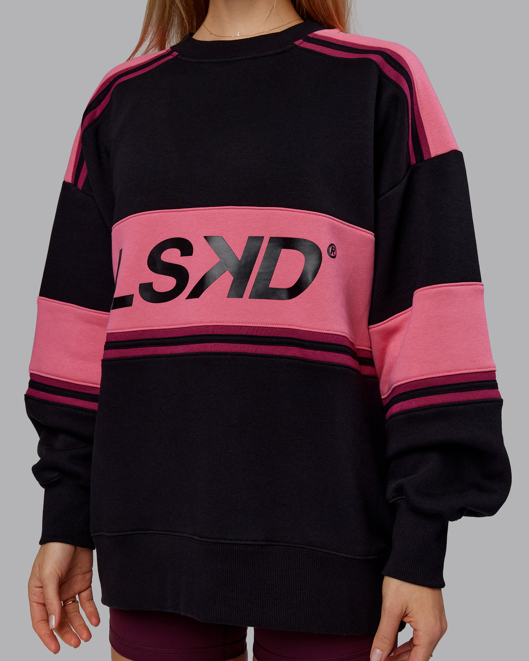 Woman wearing A-Team Sweater Oversize - Black-Hot Pink | Model:Emilie | Size:XS