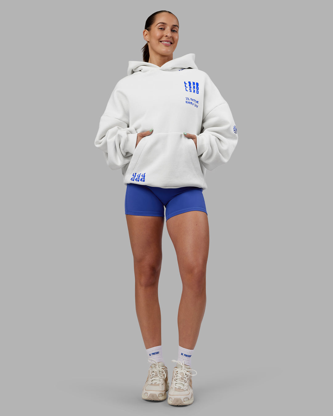 Woman wearing Abs If Not Now When Unisex Oversized Hoodie - Vaporous Gray | Model:Abbey | Size:XS
