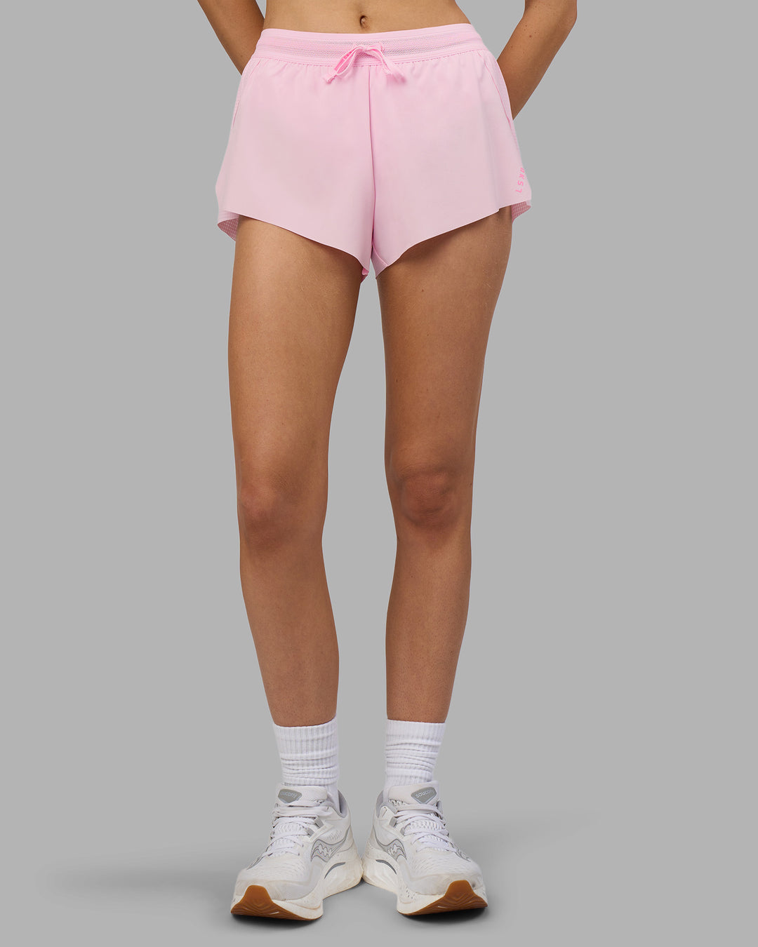 Woman wearing Accelerate 3" Running Short - Marshmallow-Candy Pink | Model:Leilani | Size:XS