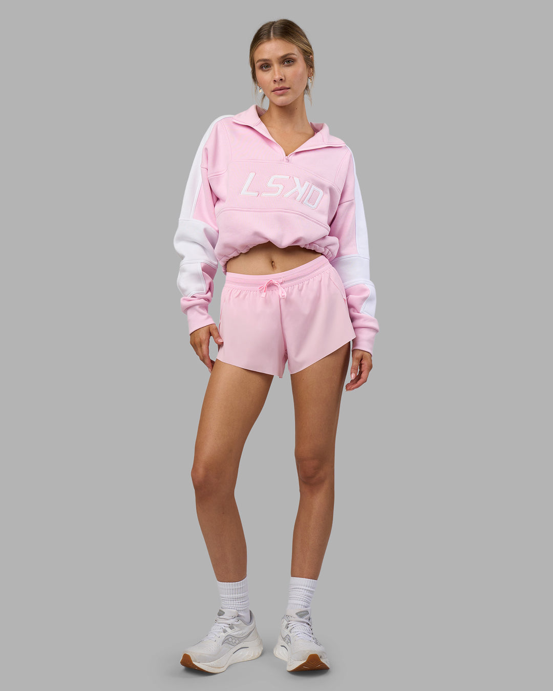 Woman wearing Accelerate 3" Running Short - Marshmallow-Candy Pink | Model:Leilani | Size:XS