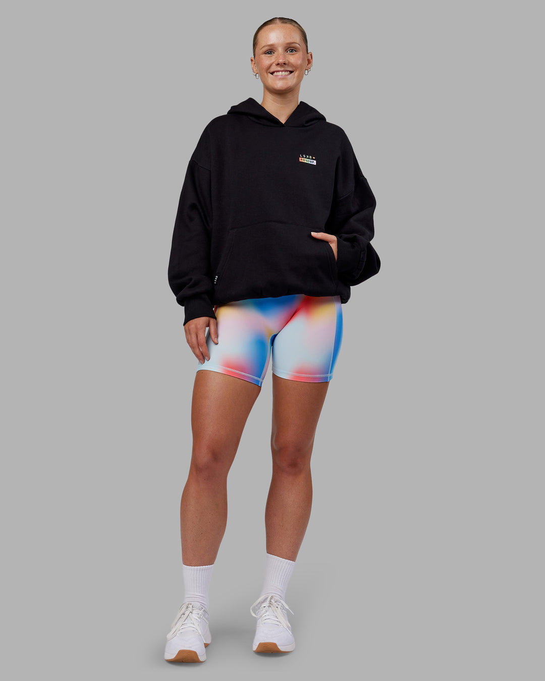 Woman wearing Fitstop Unstoppable Together Oversized Hoodie - Black | Model:Neve | Size:XS