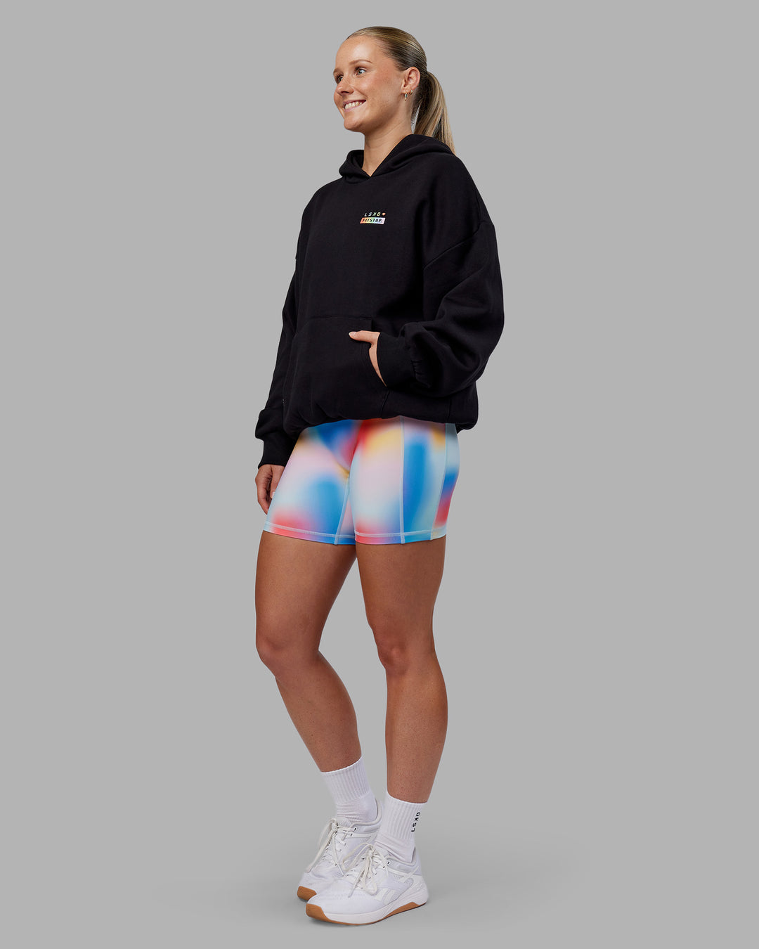 Woman wearing Fitstop Unstoppable Together Oversized Hoodie - Black | Model:Neve | Size:XS