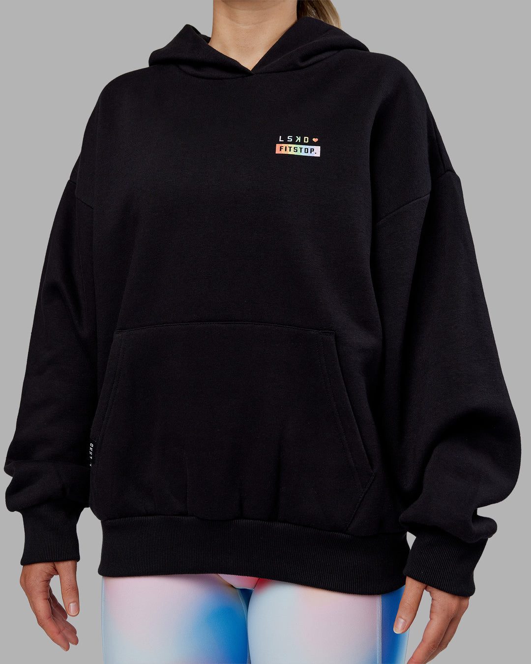 Woman wearing Fitstop Unstoppable Together Oversized Hoodie - Black | Model:Neve | Size:XS